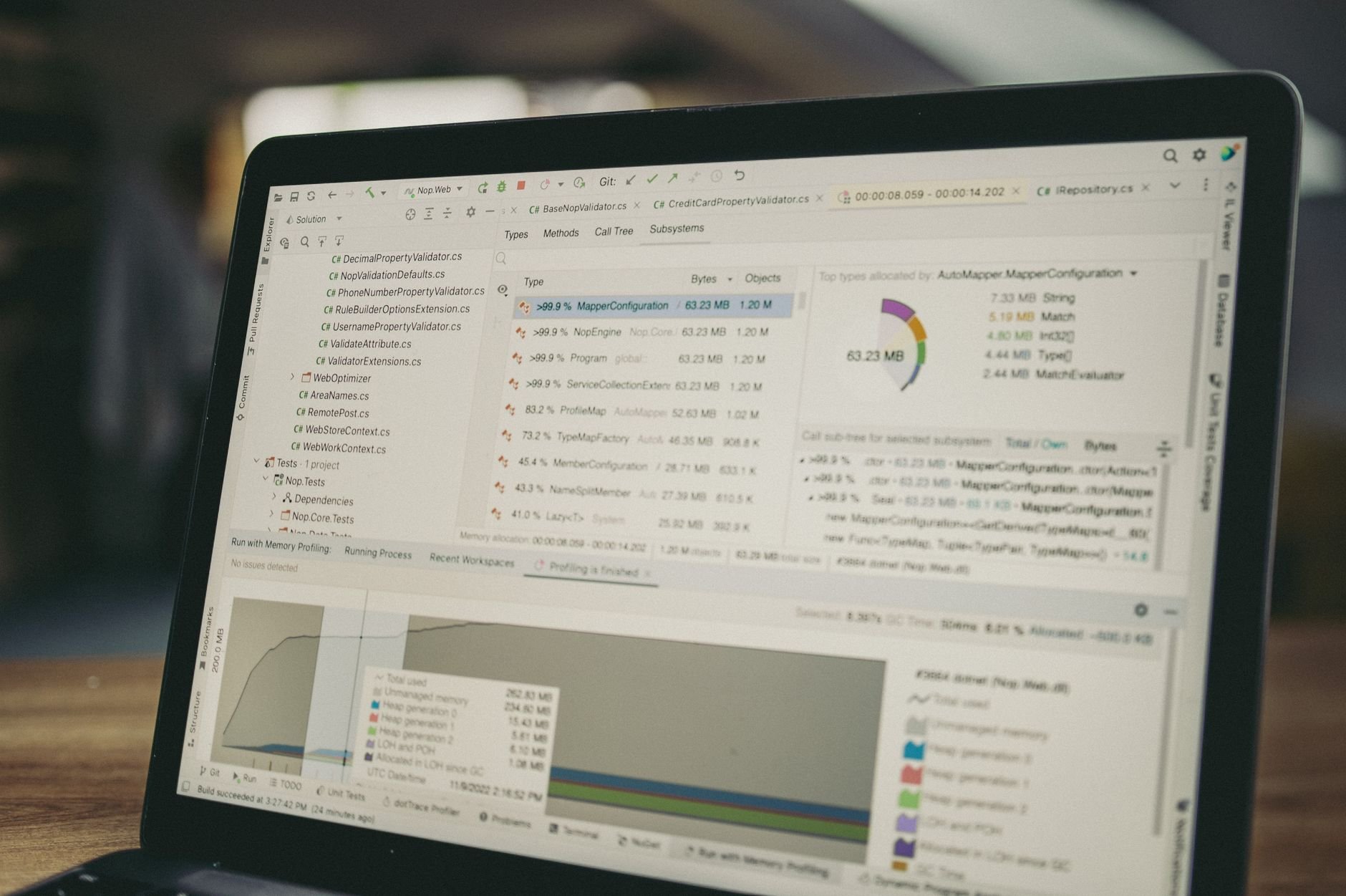 A close-up view of a laptop screen showing a coding and data analysis software interface.